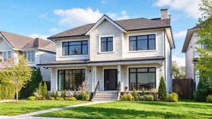 Modern two-story house with landscaped front yard.