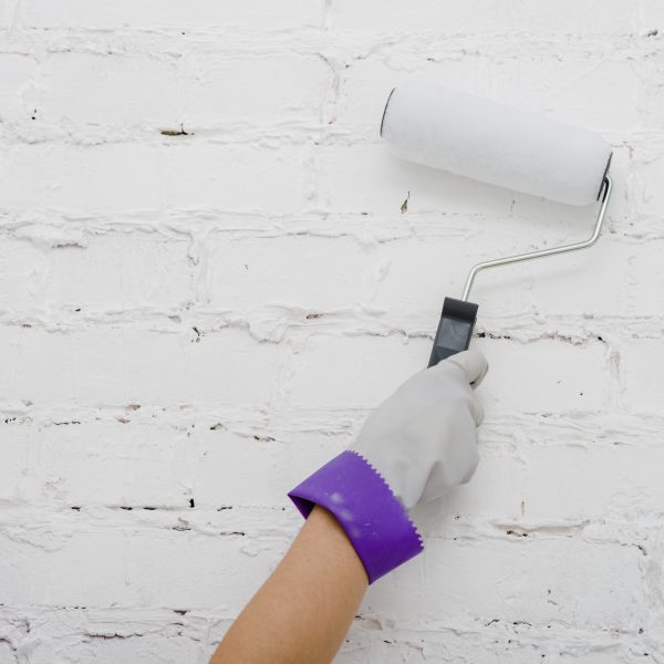 crop-hand-painting-wall
