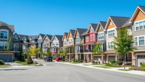 Modern row of colorful suburban townhouses
