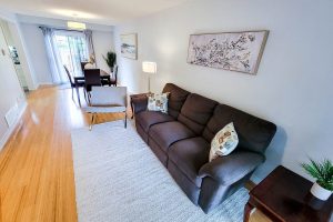 Modern living room with dining area view.