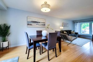 Modern living dining area with wood floors.