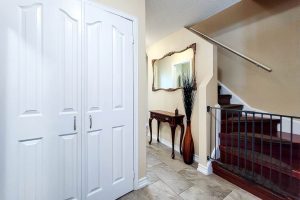 Elegant hallway with mirror and stairs