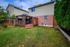 Backyard with deck and patio area.