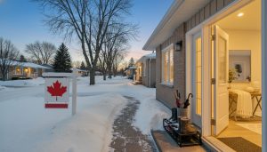 Staged Milton home in winter with cleared path, warm interior lighting, and tidy entryway