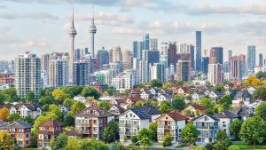 City skyline with tall buildings and residential area.