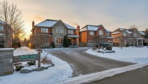 Two Georgetown houses sharing a driveway next to a private road with clear signage and clean landscaping.
